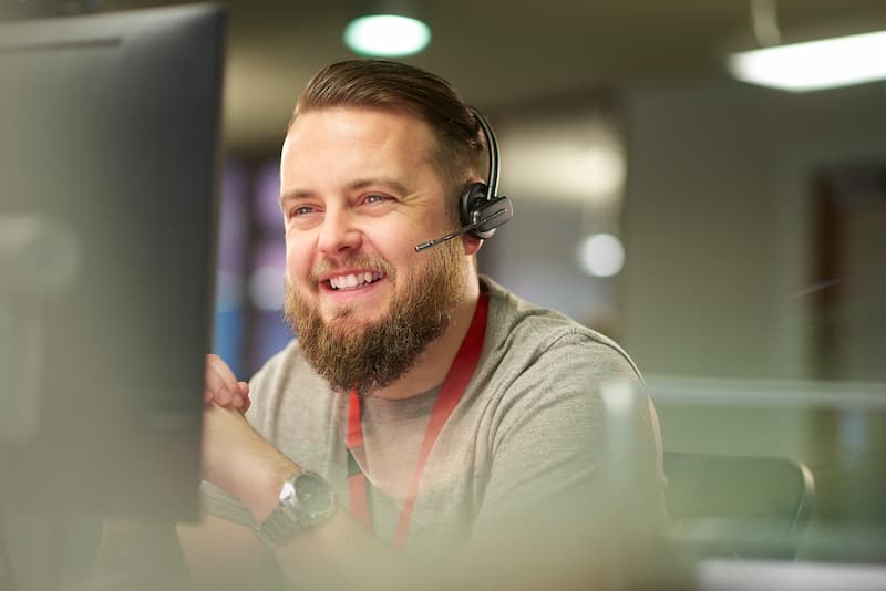 Friendly customer service representative assisting a Ripple Broadband customer with support inquiries