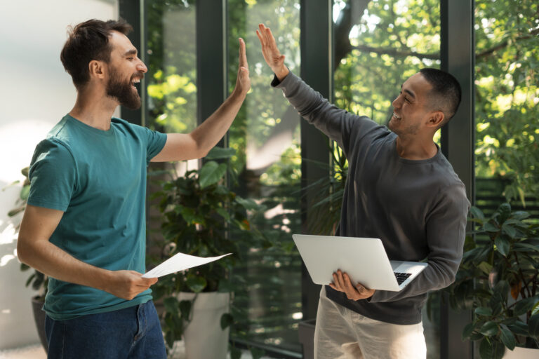 Two happy friends celebrating success with high-speed internet – Ripple Broadband's Refer a Friend program